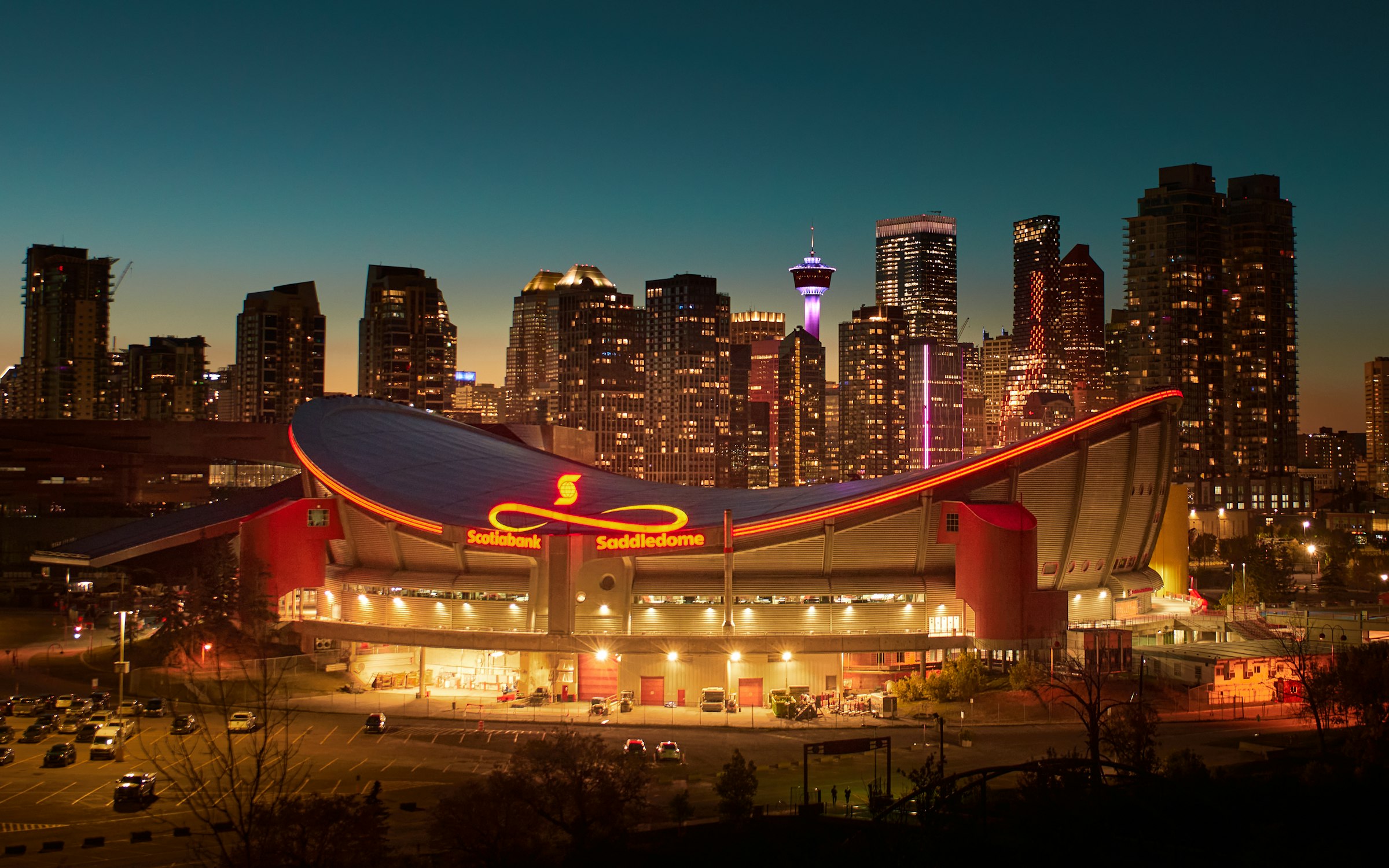 The Scotiabank Saddledome and downtown Calgary skyline at night